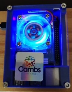 Photo of a blue Raspberry Pie device, with a Cambs Youth Panel sticker on it